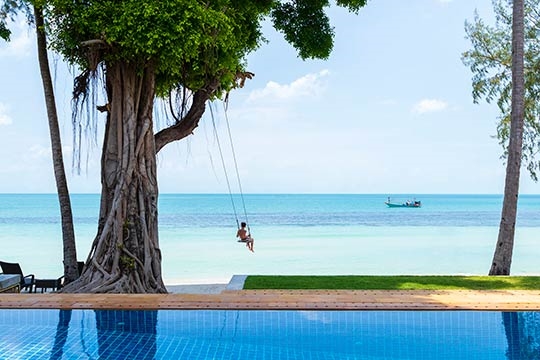 Beach swing in front of the villa